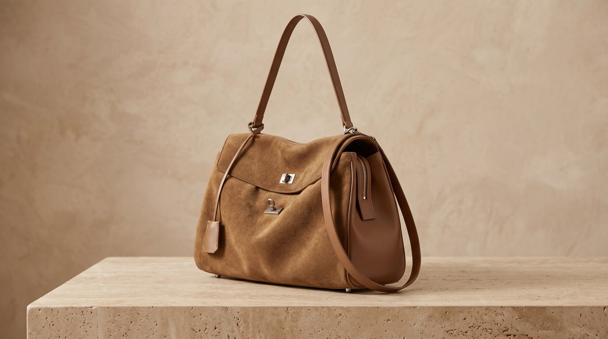 Close-up of the ALEONA handbag's premium suede in natural sunlight.