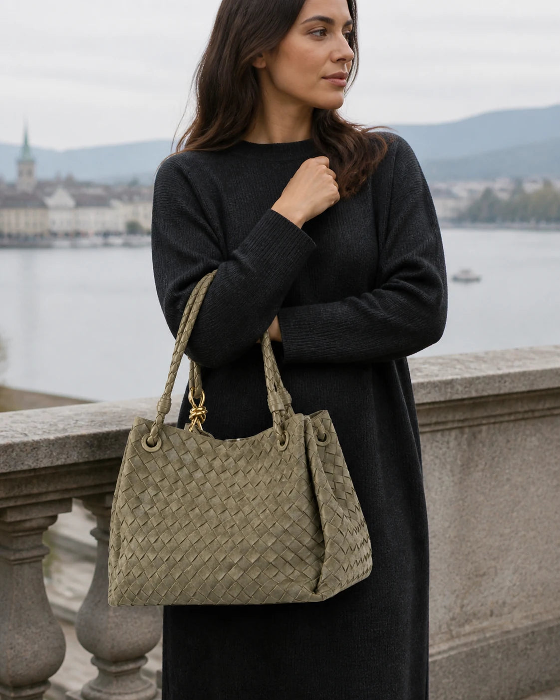 La Tessuta woven suede shoulder bag carried above Lake Zurich.